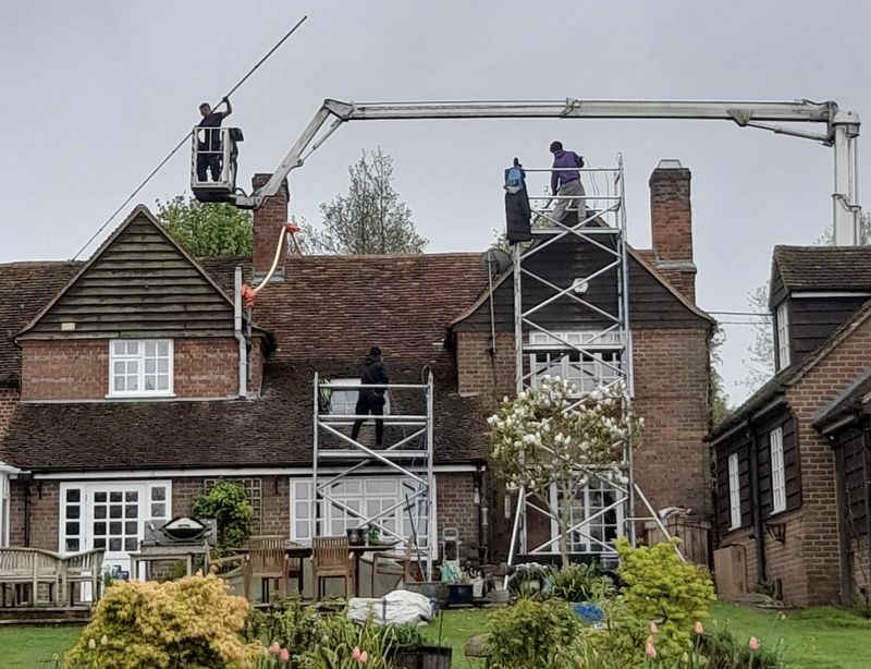 The Roof Moss Cleaners using cherry picker and scaffolding to clean roof safely and professionally in Waltham Cross, Hertfordshire