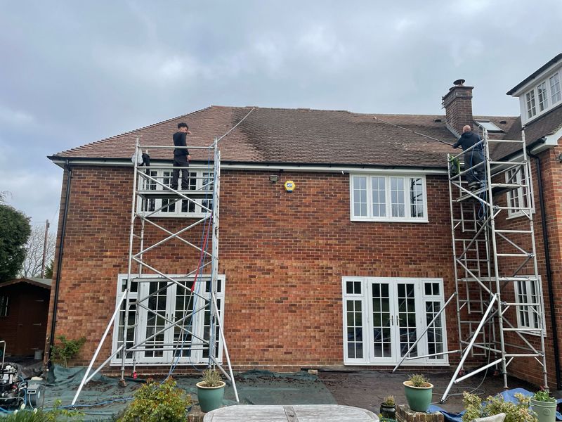 Roof cleaning carried out safely from scaffold towers by The Roof Moss Cleaners in Waltham Cross
